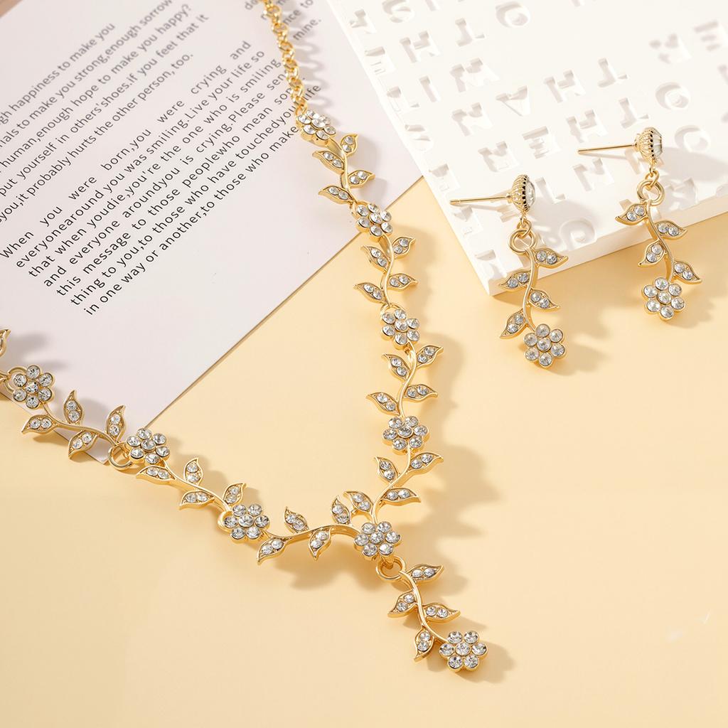 Popular Leaf and Flower Rhinestone Two-Piece Set Elegant dress paired with diamond-studded necklace and earrings for women