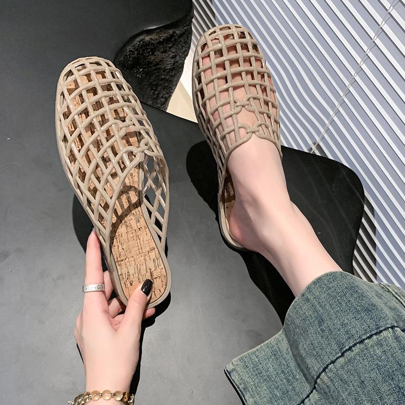 Summer new woven mesh slippers hollow transparent jelly shoes women's flat bottom outer wear bag head beach hole shoes explosion