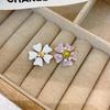 French Luxury Stud Earrings with Silver Needle and Inlaid Diamond Flower Design