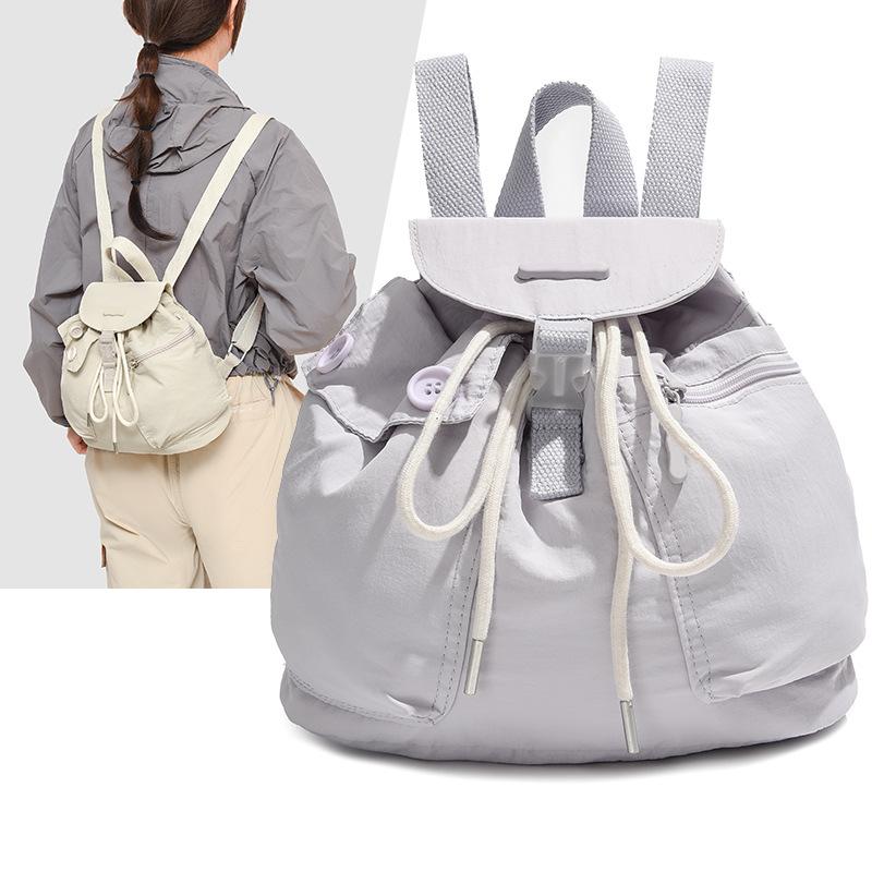 Schoolbag1011 new Korean ins women's niche design lightweight pocket button drawstring backpack outdoor nylon