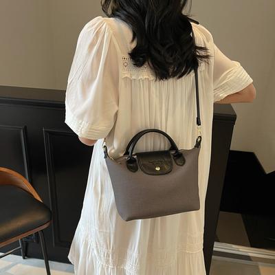 Heutige beliebte Nischendesign-Kontrastfarben-Taschen Damen neue hochwertige vielseitige Umhängetaschen Pendlerhandtaschen