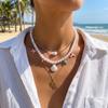 Elegante Perlenkette mit künstlichen Perlen für Damen Sommer Ozean Stil Muschel Seestern Fisch Anhänger Choker Urlaubs Schmuck