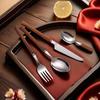 4-Piece High-End Stainless Steel Cutlery Set with Wooden Handles: Includes Knife, Fork, Spoon, and Teaspoon for Western Cuisine.