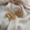 Exaggerated woven gold stud earrings retro high-end sense fashion metal sparkling niche personality European and American popular earrings women