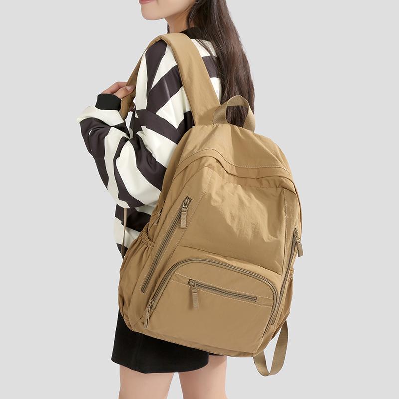 Ryggsäck i enfärgat dam lätt utomhusryggsäck stor kapacitet student skolväska