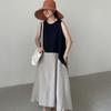 A Long Sleeveless Dress with A Vest Skirt
