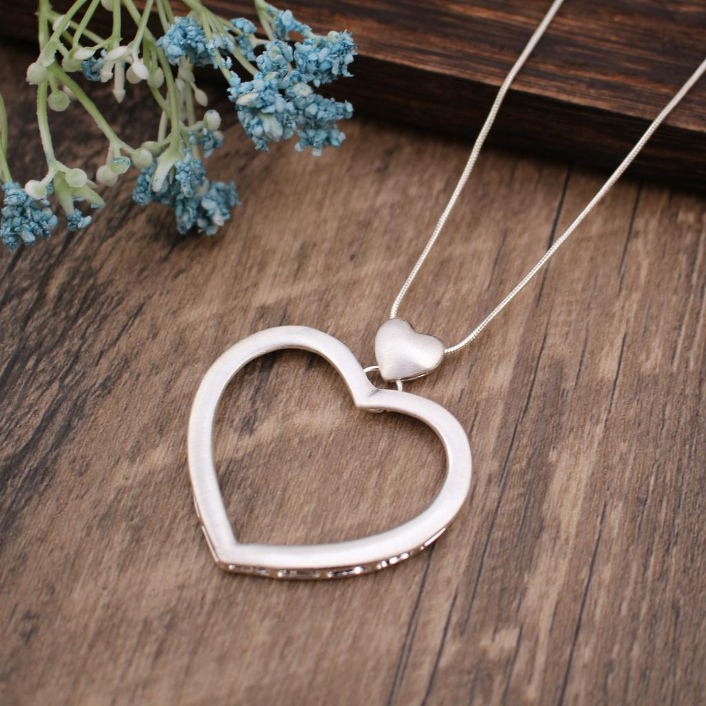 Hollow geometric flower love long necklace, women's exaggerated high-end irregular brushed pendant
