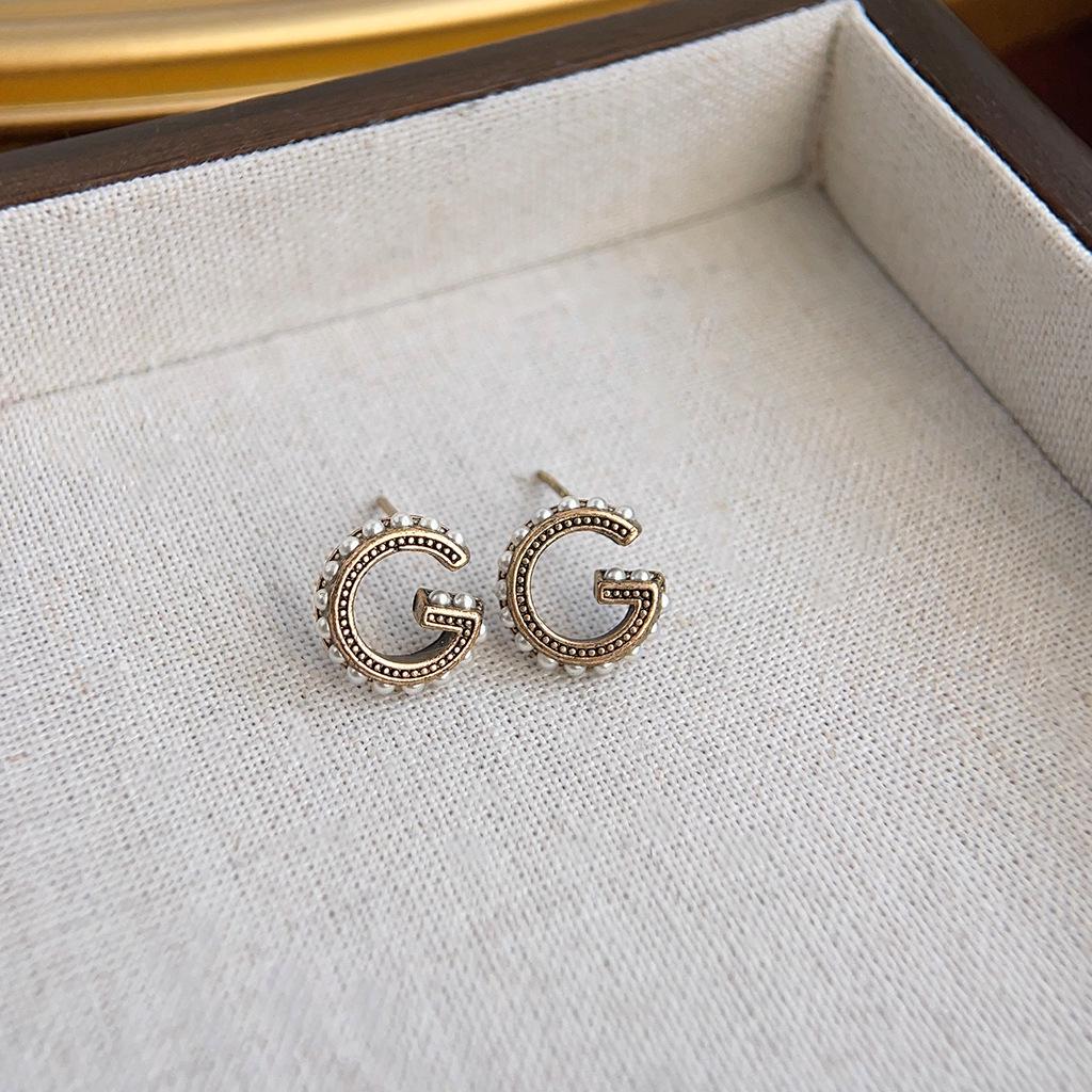 Boucles d'oreilles géométriques vintage en perles pour femmes - Style rétro de Hong Kong, luxe léger, sensation haut de gamme