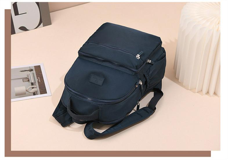 Large Capacity Unisex Splash-Proof Nylon Backpack: Travel, Casual, Fashionable, Suitcase Handle Compatible, School Bag