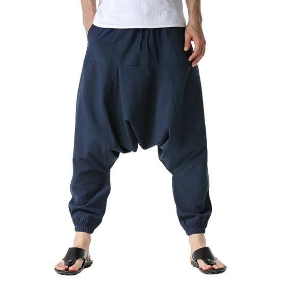 

Брюки с глубоким шаговым швом, средней посадки, эластичный пояс на шнурке с большими вместительными карманами, свободные L темно-синий