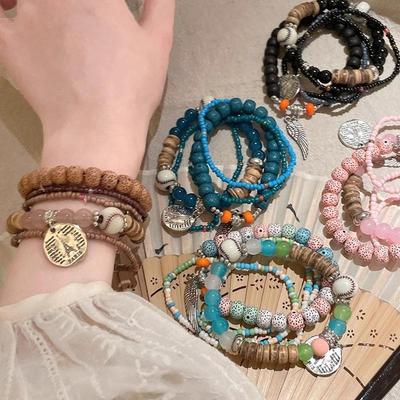5 Stück Böhmisches Mehrschicht-Reisperlenarmband Flügelanhänger Elastisches Seilarmband Schmuck im ethnischen Stil