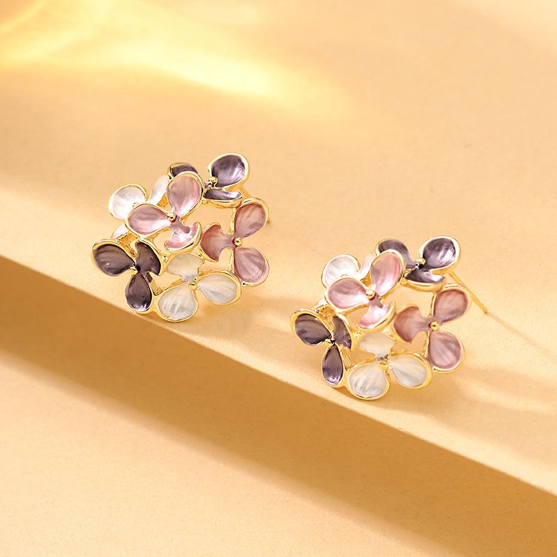 Sweet temperament small fresh drop glaze hollow flower leaf stud earrings light luxury niche high-end fairy earrings