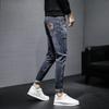 Vaqueros para hombre marea versión coreana de la marea de primavera y otoño flujo Slim pies pequeños nuevo verano sección delgada pantalones largos vaqueros negros para hombre