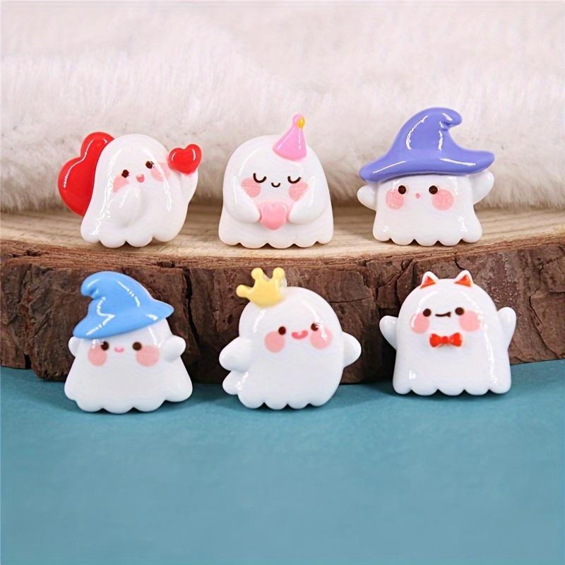 A pack of 12 adorable Halloween ghost resin accessories for DIY hair clips and decorations, including shoe buckles, hat patches,