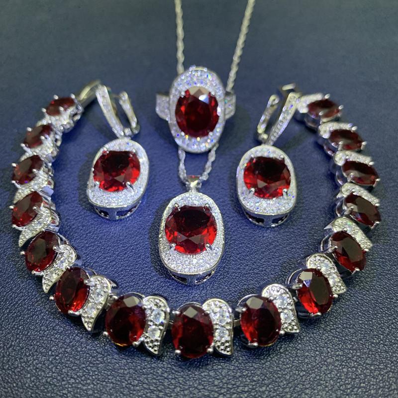 Čtyřdílná sada vykládaná světle modrým zirkonem Dámské náušnice náramek prsten Módní párty svatba