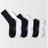 Black & White Solid Sport Socks: Cushioned, Simple, and Versatile for Basketball & Running.