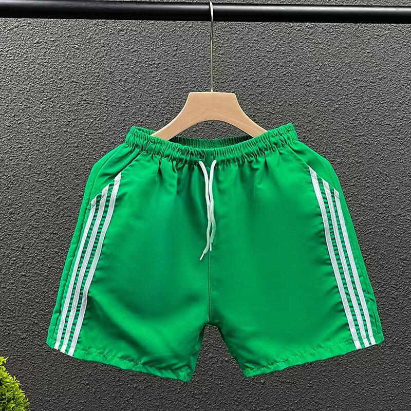 

Чоловічі швидковисихаючі спортивні штани в смужку три чверті XL зелений