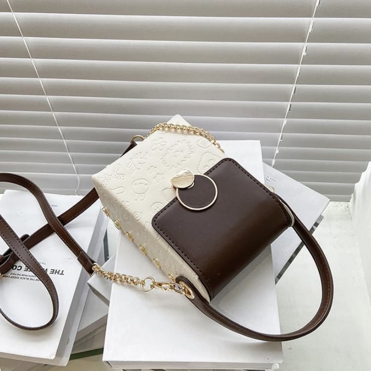 White and brown color matching cartoon embossed vertical mobile phone bag