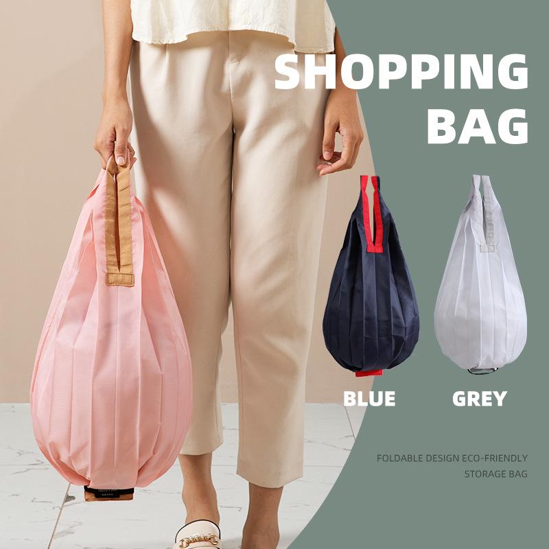Eco-Friendly Foldable Shopping Bag: Large Capacity, Ultra-Light, Accordion Pleat Design with Hanging Buckle for Travel.
