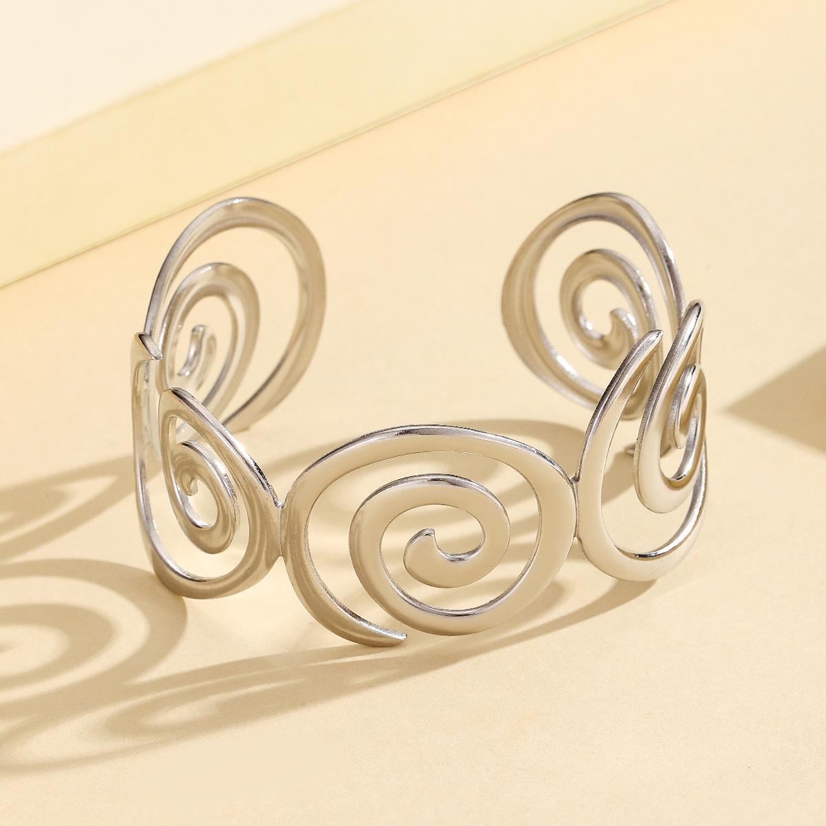 Retro Hollow Spiral Stainless Steel Bracelet: 18K Gold Plated Women s Jewelry