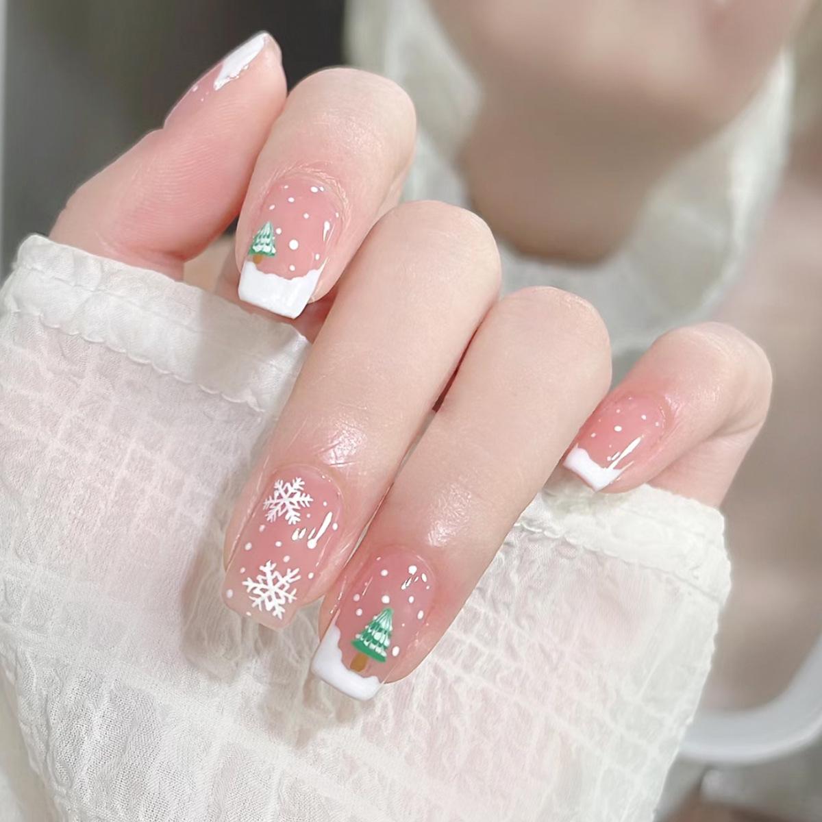 

Nude Pink Christmas Press-on Nails with Snowman, Tree & Snowflakes Design