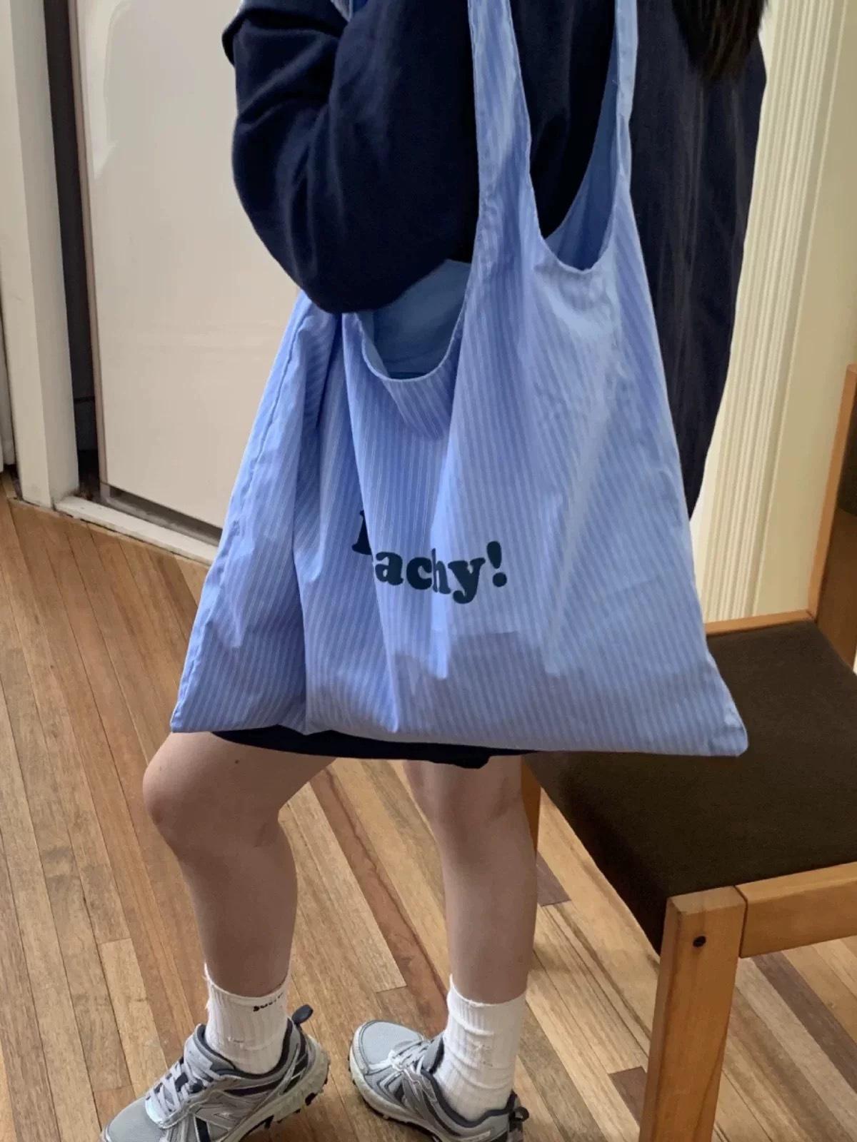 

Bags Women s shoulder large-capacity nylon bags Striped letter printed cloth bags Simple and versatile fashion niche bags синий