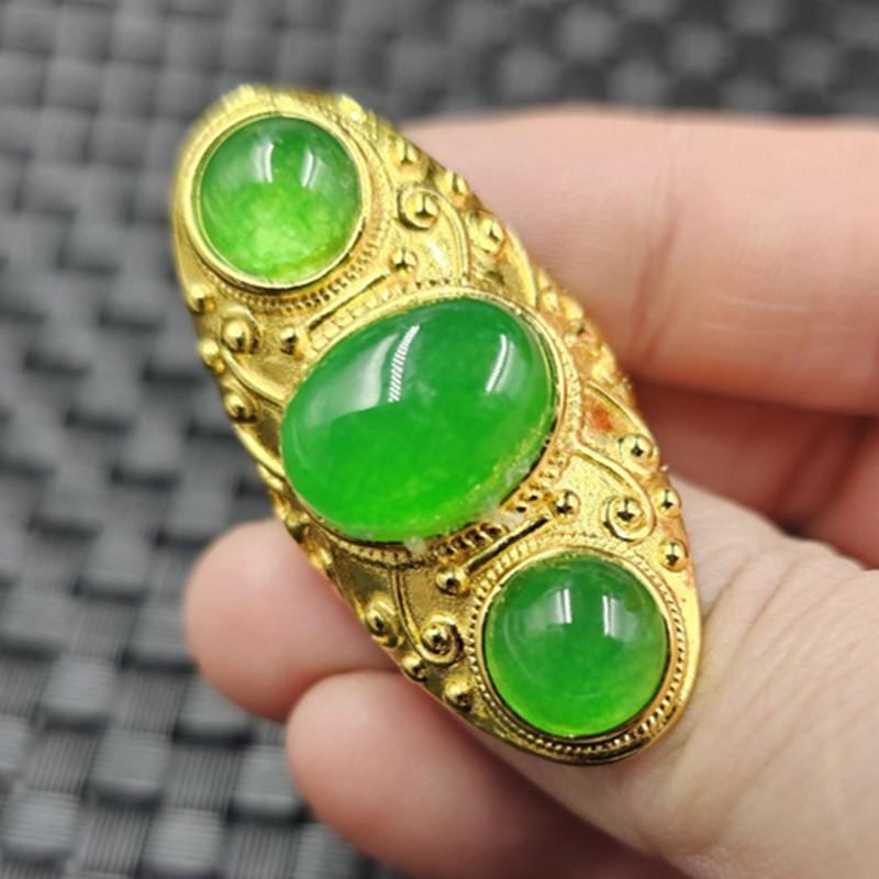 Adjustable Emerald Jade Ring: Egg-shaped, three bright green faces, gold band