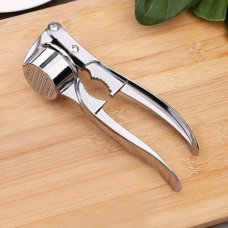 Durable 2-in-1 garlic press and nutcracker - High-Quality Manual Garlic Press Easily chops and peels Very suitable for home cooking Essential