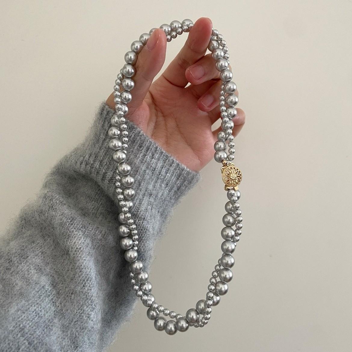 

Двухслойное ретро-колье с жемчугом подсолнечника и компасом в виде бога солнца