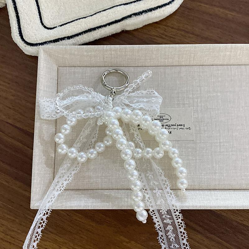Vynikající perly Korálkový mašličkový přívěsek na klíče Krajkový mašličkový řetízek na telefon Kroužek na klíče Přívěsek na tašku Pro kroužek na klíče od auta Peněženka Batoh Přívěsky