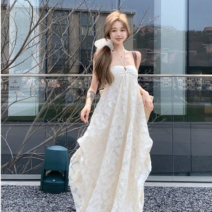 Seaside vacation wind backless neck dress beach skirt women's early spring with chest pad A-shaped skirt pure desire hollow dress