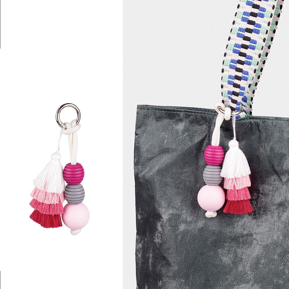 Hochwertiger Taschenanhänger mit niedlichem Ball und Dopamin-Quaste, fester Schlüsselanhänger-Zubehör, vielseitige kreative Mode-Serie