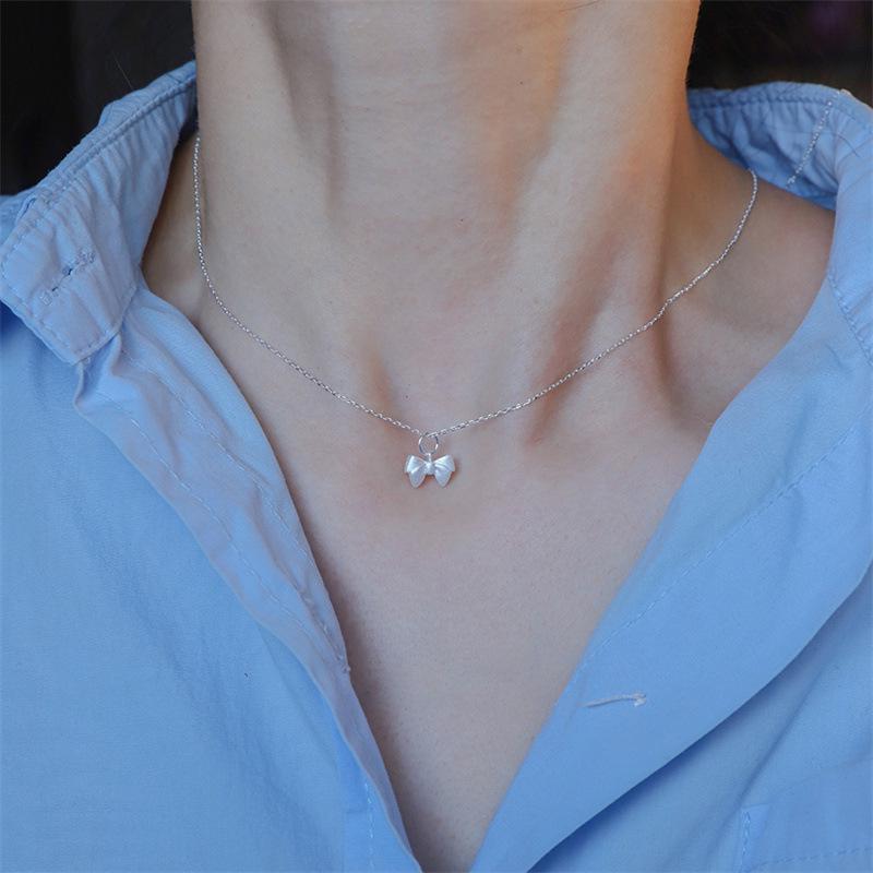 Charming Christmas Bow Pendant Necklace: Simple, Frosted Clavicle Chain for Women - Autumn Light Luxury Choker