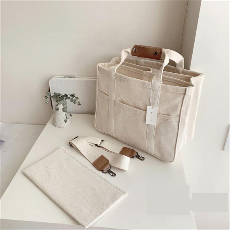 

2025 Korean Multi-functional Canvas Mommy Bag - Single Shoulder, Crossbody, and Handheld Options. белый