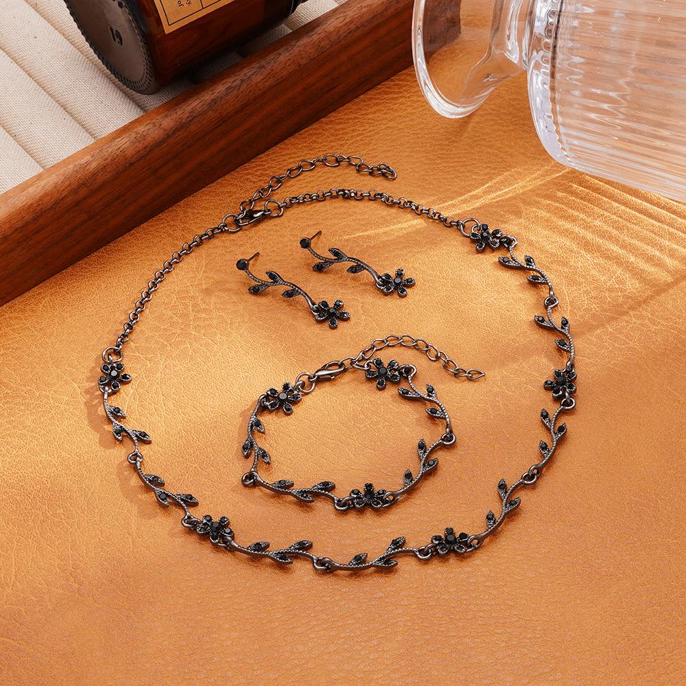 Korean-Style Bridal Jewelry Set: Light Luxury Rhinestone Leaf Flower Necklace, Earrings, & Bracelet