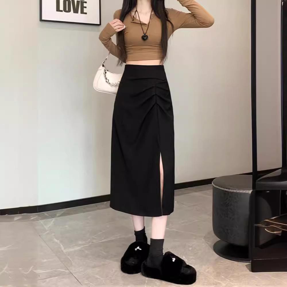 Dámská midi sukně áčkového střihu s vysokým pasem a rozparkem pro raný podzim 2025