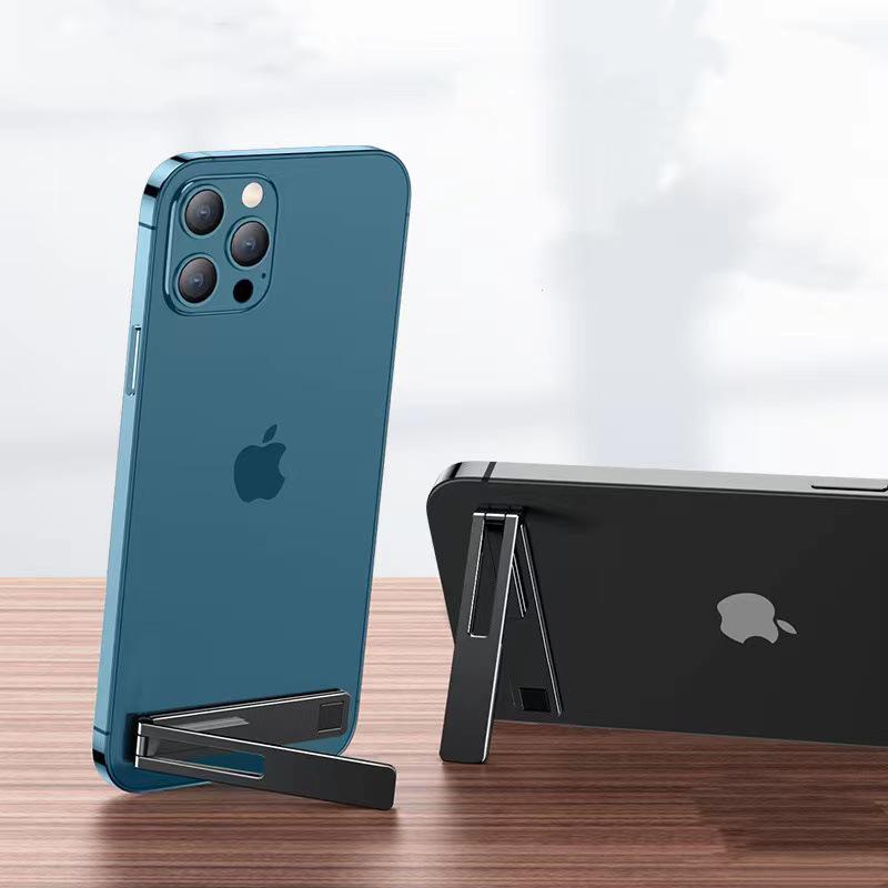 

Compact Foldable Metal Phone Stand: Ultra-thin, One-piece, Black/Silver, Portable, Desktop Back Sticker, Lazy Holder.