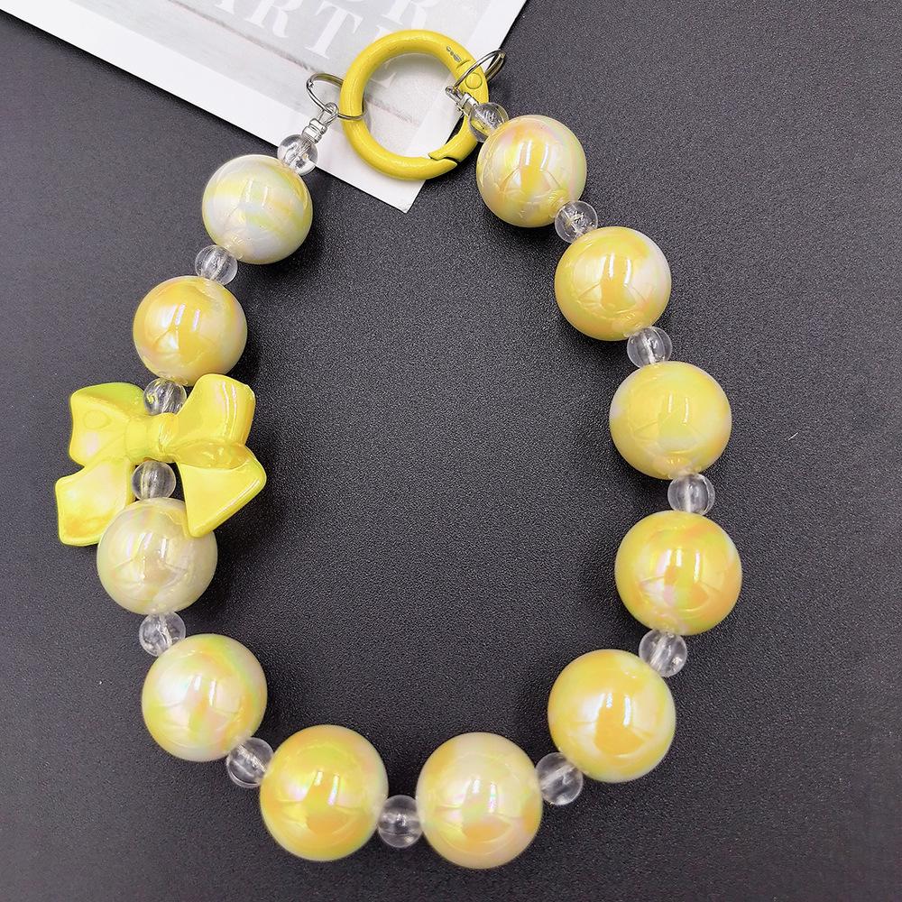 

Трехцветная подвеска-ключ с бисером «Русалочка» и бантом для чехлов и сумок для телефонов жёлтый