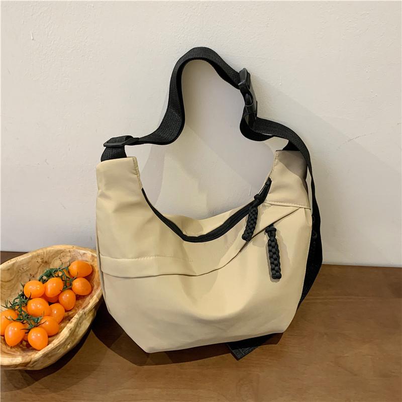 Bolsa de ombro casual simples de nylon para mulheres com zíper sólido, novo estilo de bolsa de ombro, grande capacidade, moda versátil