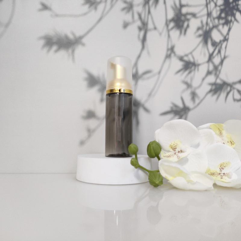 Available 60ml Transparent Black Foam Mousse Bottle for Face Wash and Travel-friendly Cosmetic Packaging.