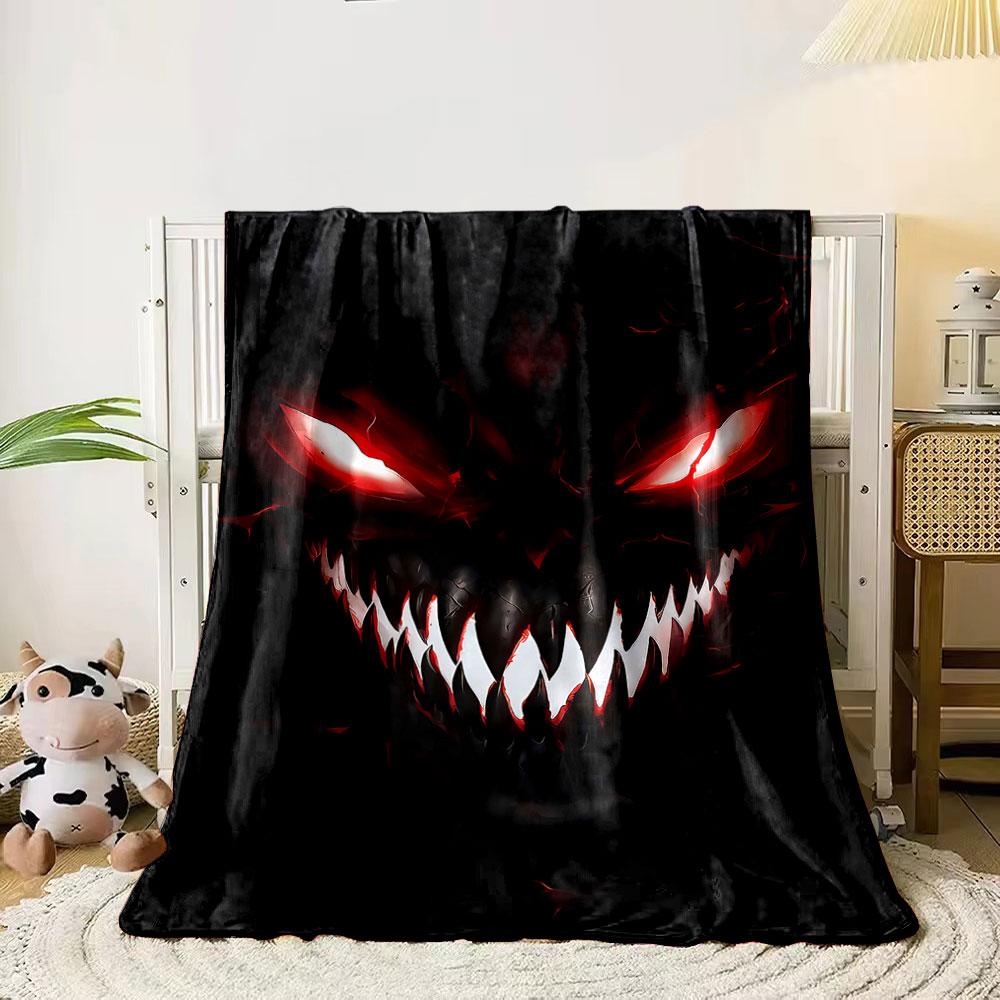 Sinister, glowing red eyes and sharp white teeth in a dark background. for all seasons blanket lunch break throw gift