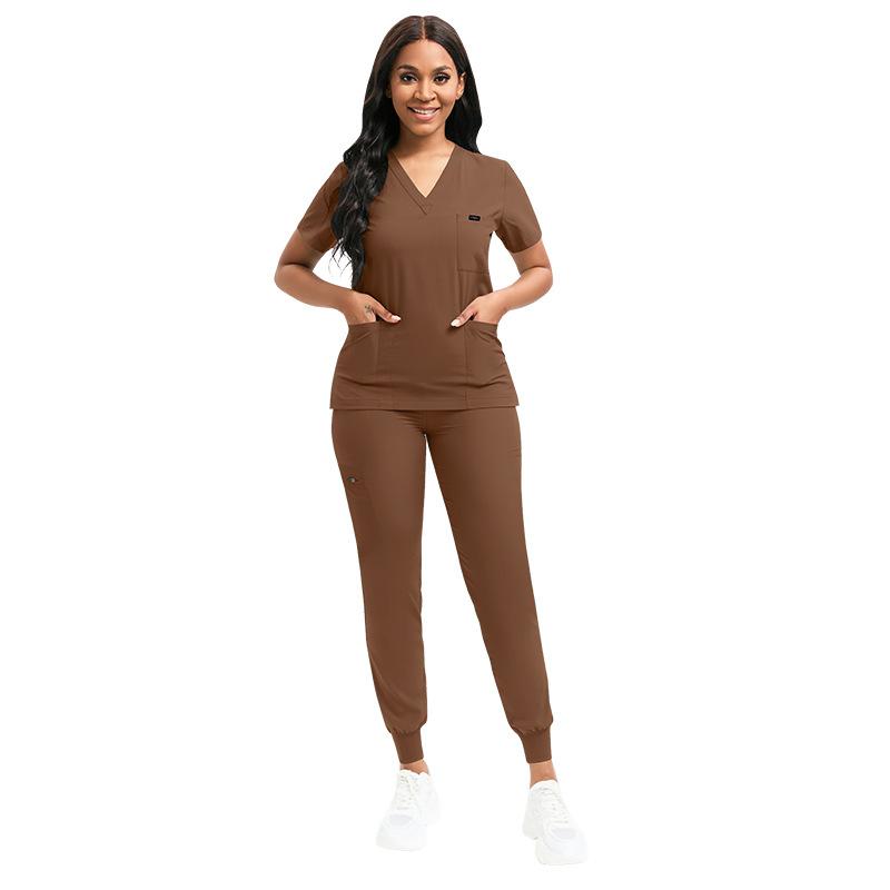 Ensemble Scrubs Stretch Femme Uniformes d'Infirmière Ensemble Scrubs Cliniques Infirmière Médecin Vêtements de Travail Anti-Poussière Haut Scrubs Médicaux + Pantalon Jogger