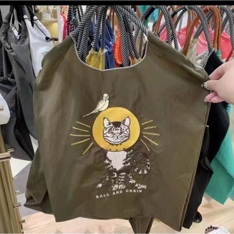 „Eko-šetrná japonská nylonová vyšívaná plátěná nákupní taška s květinami“