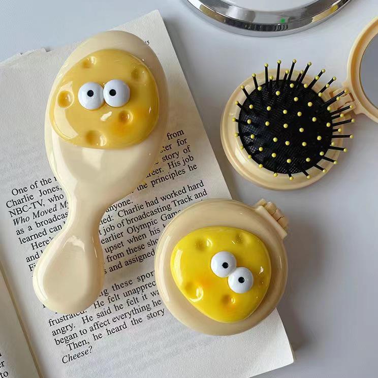

Cute Cartoon Cheese Egg Airbag Mini Massage Comb with Folding Mirror