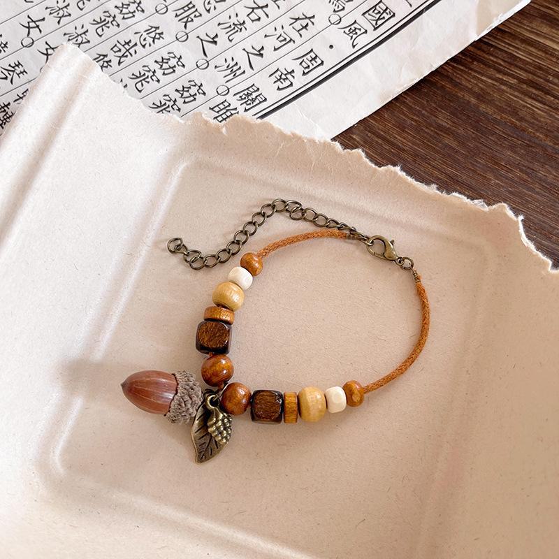 

Винтажное ожерелье в китайском стиле с плетеной вручную веревкой и кисточкой из сухофруктов bracelet S619 коричневый