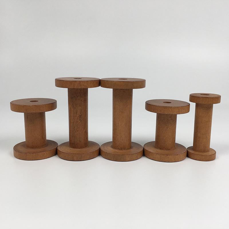 Retro Solid Wood Spool: Nostalgic Handmade Thread Organizer for Cross-Stitch and Crafting.