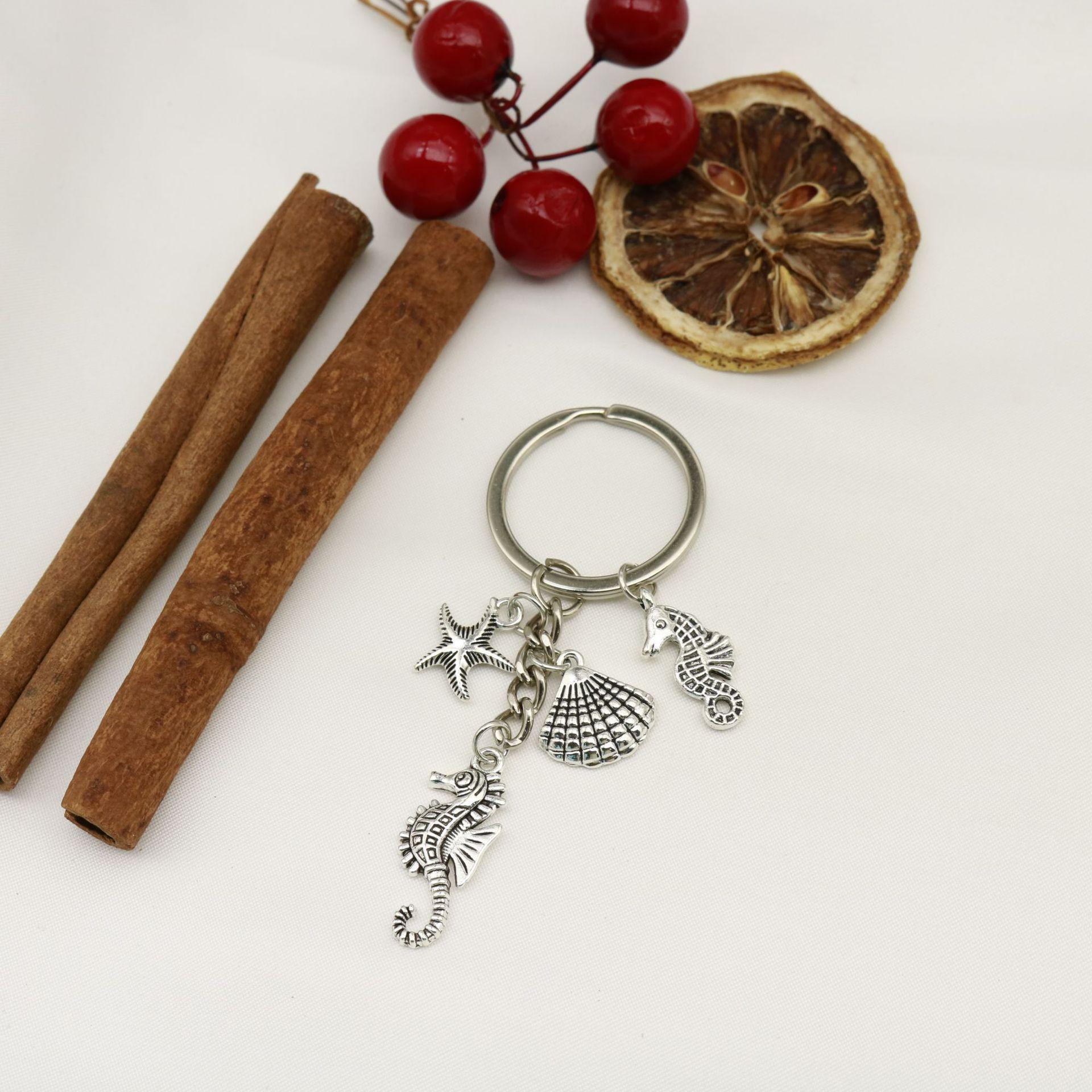 Ocean Charm Keychain with Starfish, Shell, Dolphin, Turtle & Mermaid Tail серебряный