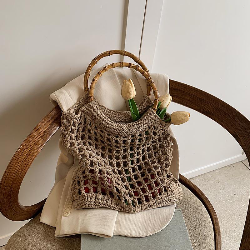 Hand carry woven bag women's Korean version ins fashion simple casual straw bag 2025 niche high-end hollow women's bag