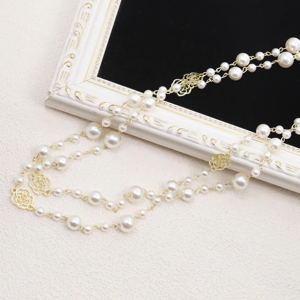 Korean Long Pearl Necklace: Trendy Multi-layer Hollow Flower Sweater Chain for Women