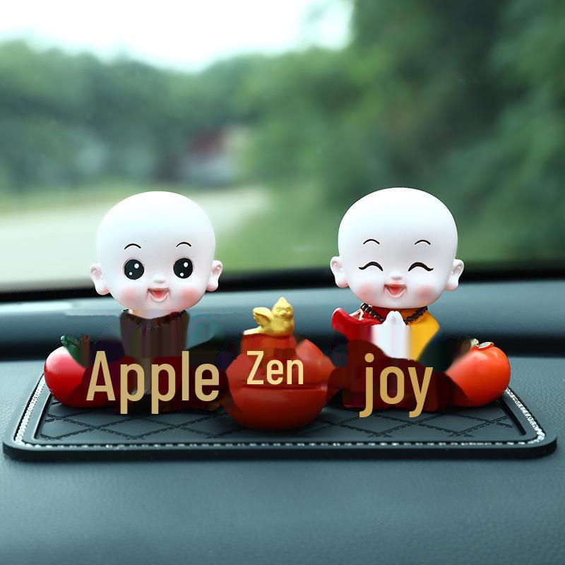 Creative Little Monk Maitreya Buddha Car Ornament: Cute, Shaking Head Resin Doll for Car Interior Decoration and Safety.